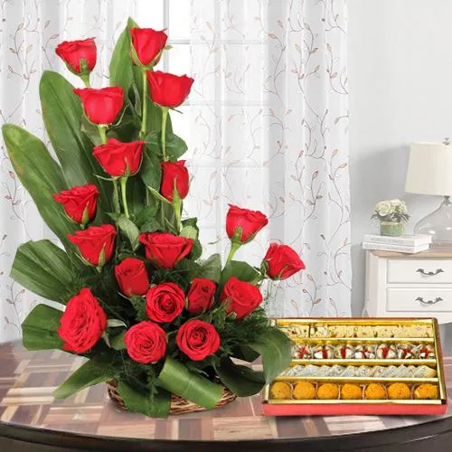 Fashionable Red Colored 18 Roses Bouquet with 1/2 Kg. Mixed Sweets