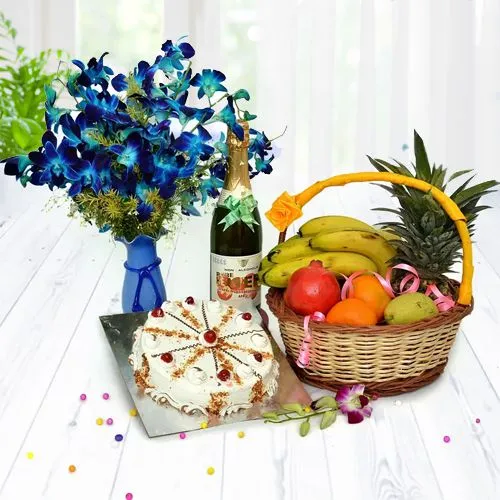 Elegant Vase of Orchids with Butterscotch Cake, Mixed Fruit Basket n Sparkling Juice