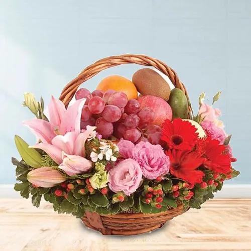 Delightful Fresh Fruits Basket decorated with Lily, Roses n Gerberas