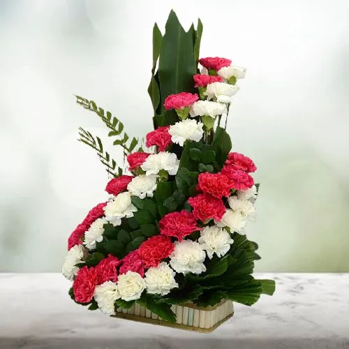 Gorgeous Swirl Arrangement of Carnations in a Basket