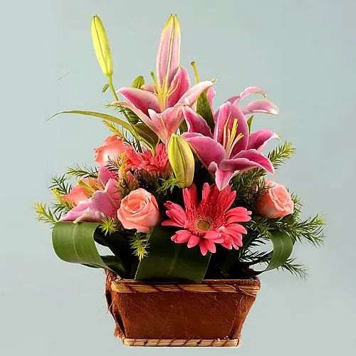 Joyful Arrangement of Fairy Tale Pink Flowers in Basket	