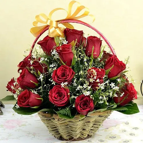 Cheerful Display of Red Roses in Round Basket 	