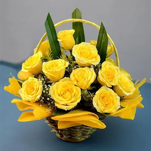 Cheerful Basket of Sun kissed Yellow Roses with Greens