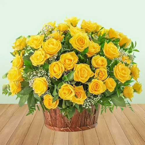 Lovely Basket of Yellow Roses with Green Leaves