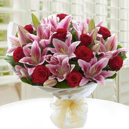 Expressive Hand Bunch of White Lilies N Red Roses